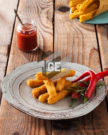 Fried breaded chicken breast steaks with rosemary